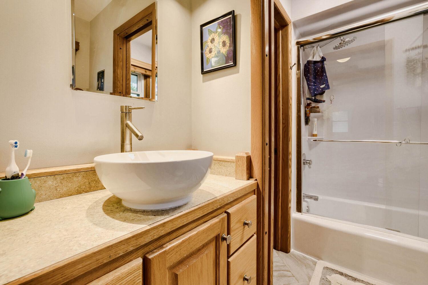 Unique walk-through bathroom, offers 2 sinks and 2 toilets
