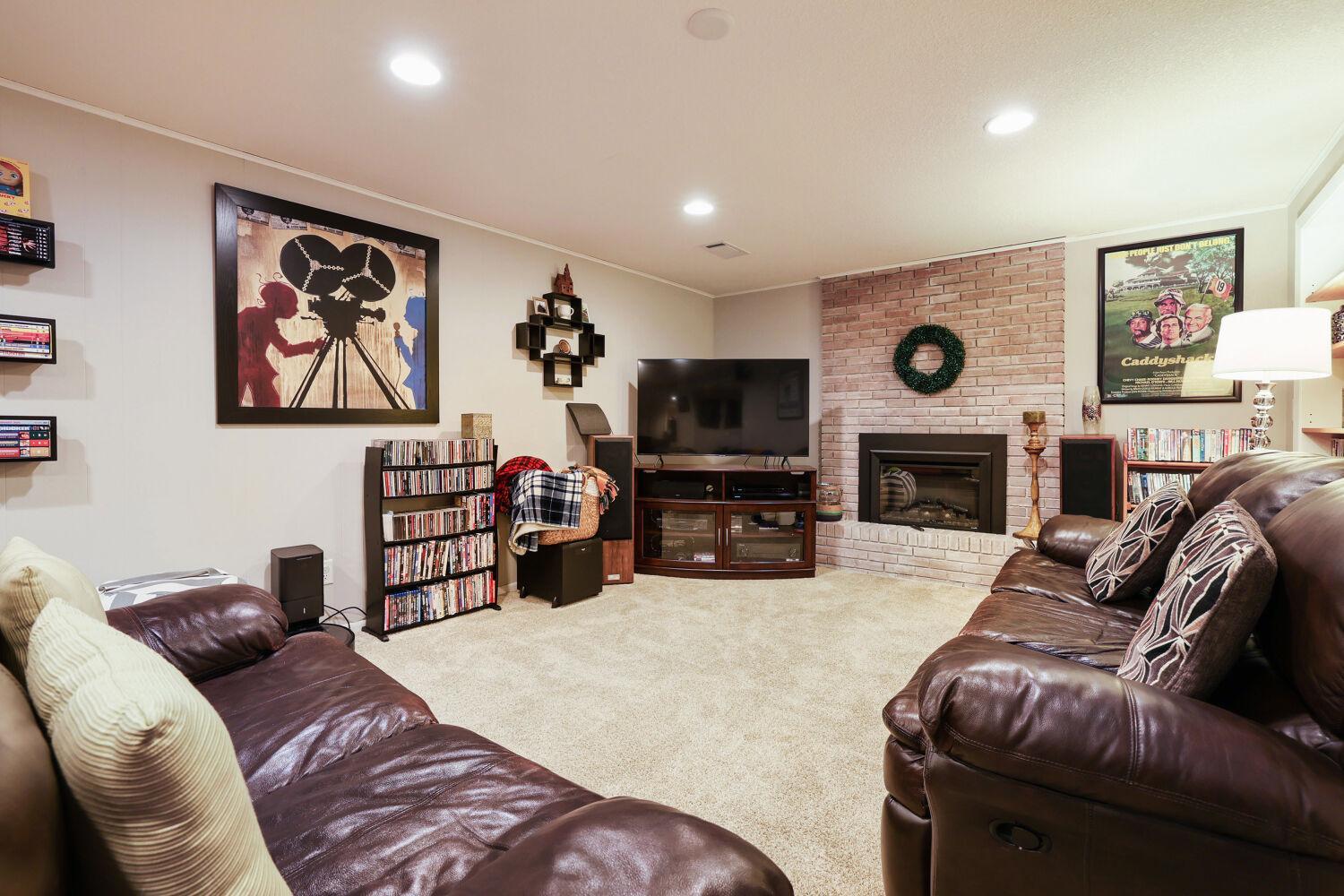 Large family room with new electric fireplace and baseboard heat