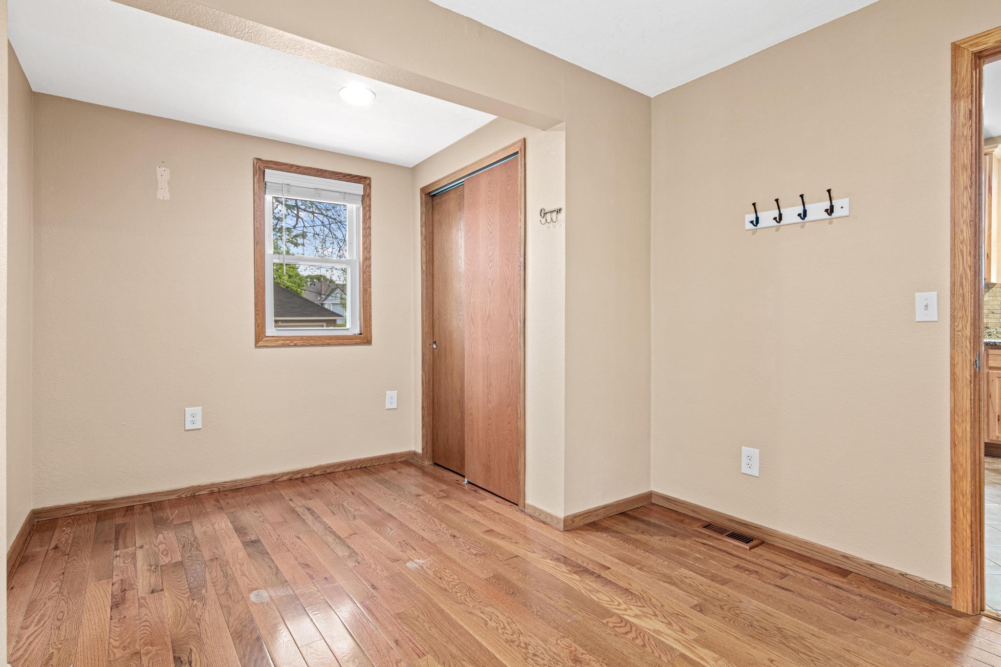 Another view of primary showing closet and location off kitchen