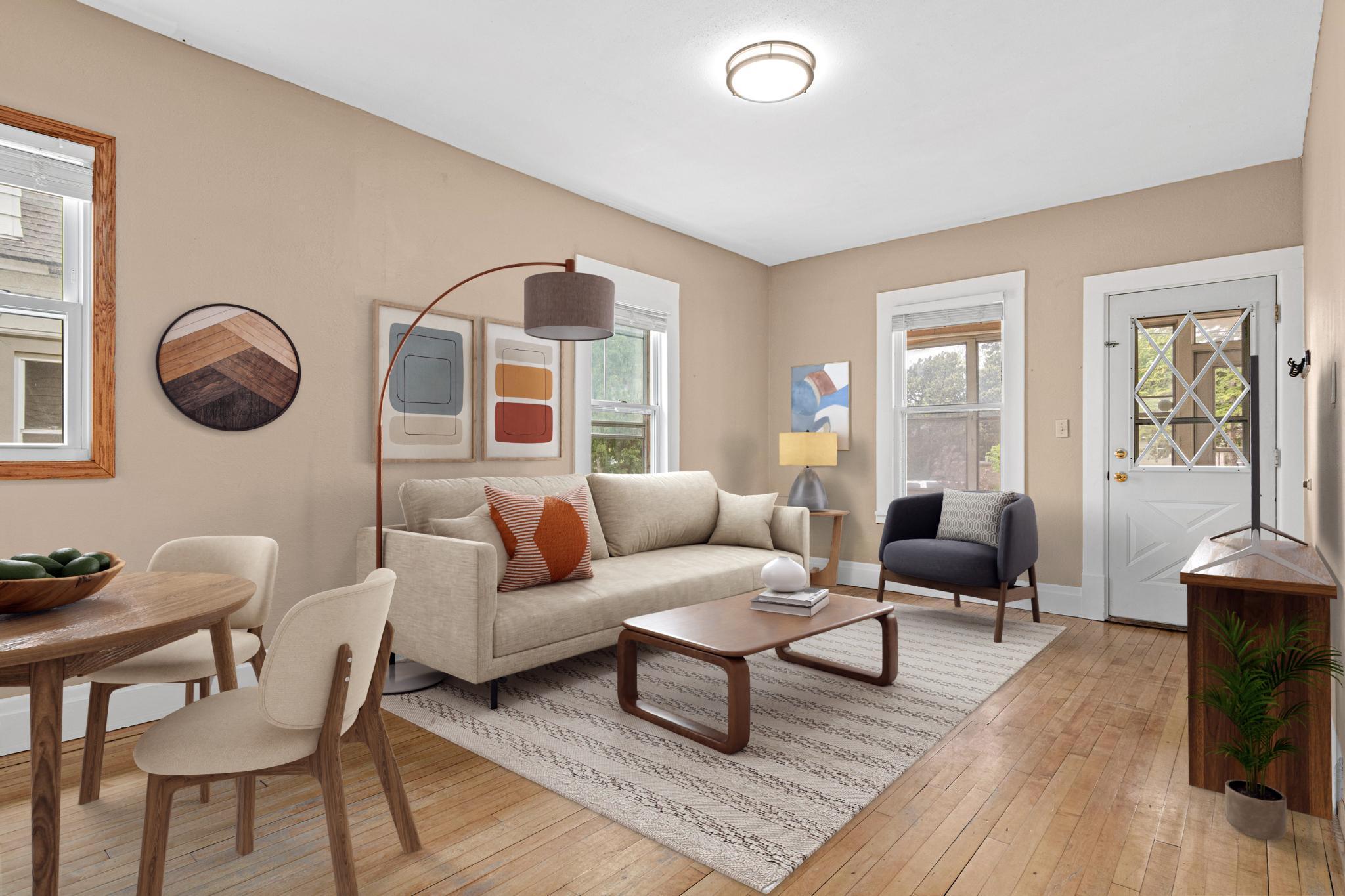 Living and dining space thoughtfully connected for everyday living combining comfort and character! (Virtually Staged)