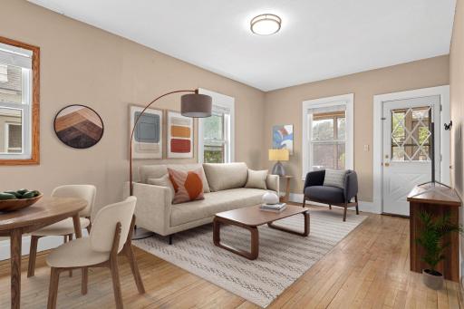 Living and dining space thoughtfully connected for everyday living combining comfort and character! (Virtually Staged)