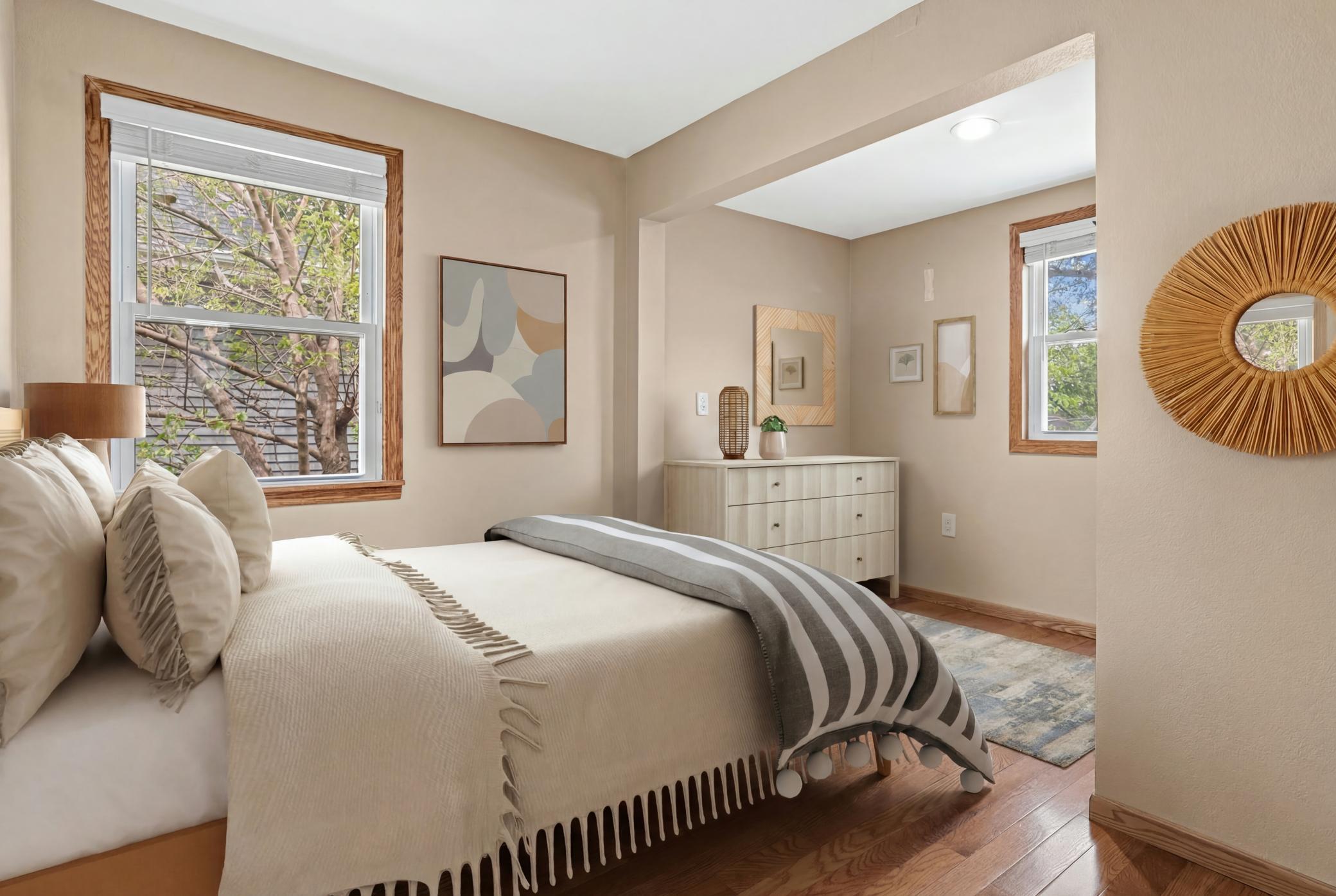 Main primary off kitchen has space for a full or a queen with a dressing area and closet! (Virtually Staged)
