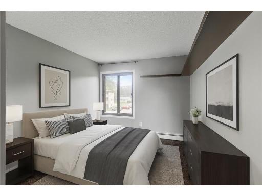 Your beautiful primary bedroom! Added built-in shelving. This photo has been virtually staged to display the livability.