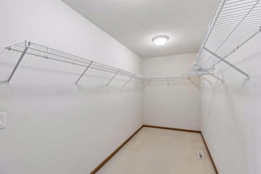 Expansive Primary Walk-In Closet with Abundant Storage.