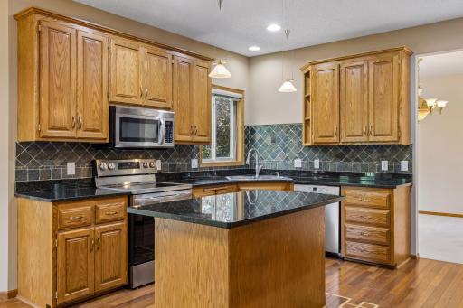 Spacious Kitchen with Custom Cabinetry & Granite