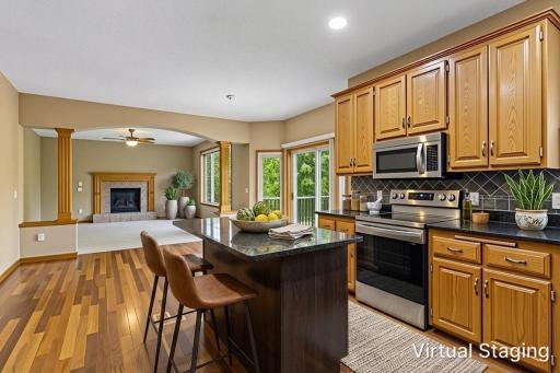 *Virtually staged Upscale Kitchen with Rich Cabinetry, Granite & Designer Tile