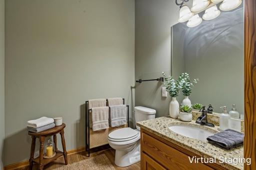 Main level guest 1/2 bath *virtually staged*