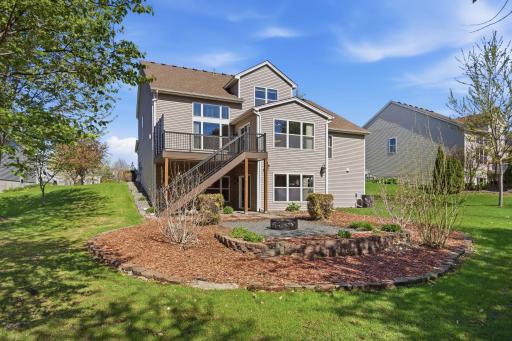 A picturesque view of the beautiful backyard, set on nearly a half-acre lotâan ideal setting for relaxing, entertaining, and connecting with wonderful neighbors.