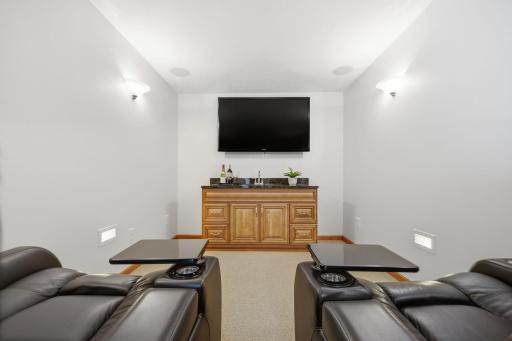 One of the homeâs standout features is your very own theatre room, complete with a stylish bar areaâperfect for cozy evenings spent enjoying your favorite movies.