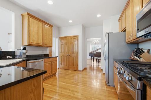 The open kitchen is thoughtfully designed for entertaining, offering generous counter space, extensive cupboard storage, and an impressive amount of storage. The kitchen has newer Stainless Steel appliances, - Stove, Dishwasher and Refrigerator