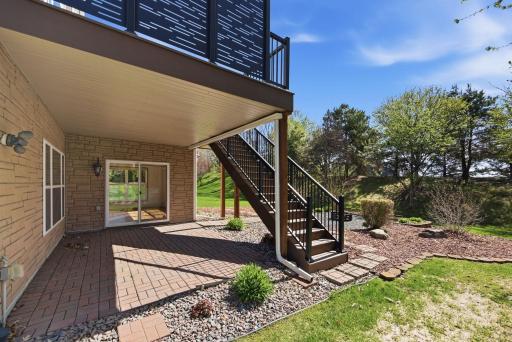 A charming lower-level patio offers a peaceful retreatâperfect for staying cool on warm days or relaxing while watching the rain on a cool summer afternoon.