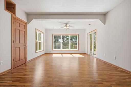 The LL living/family room is thoughtfully designed with upper display cubbies for treasured items and concealed storage behind the two lower doors. walks out to a private patio and is enhanced by oversized daylight windows and the Lower Level Walkout