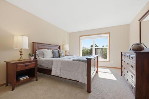 his upstairs bedroom features plush carpeting, abundant natural light, and generous closet space. All of the rooms throughout the home are exceptionally spacious.