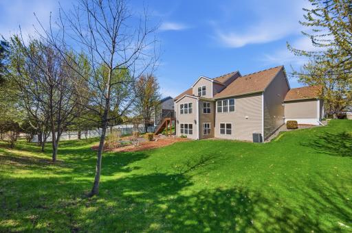 The spacious backyard provides ample room for play, entertaining, and enjoying outdoor activities.