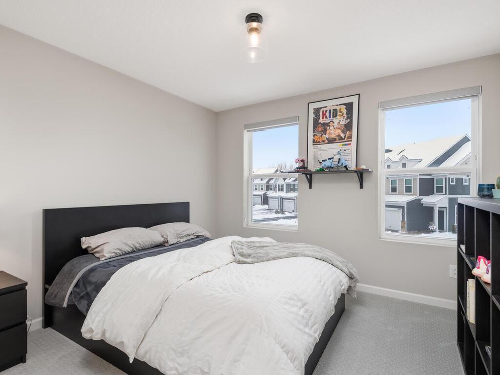 3rd bedroom with walk-in closet with custom window treatments!