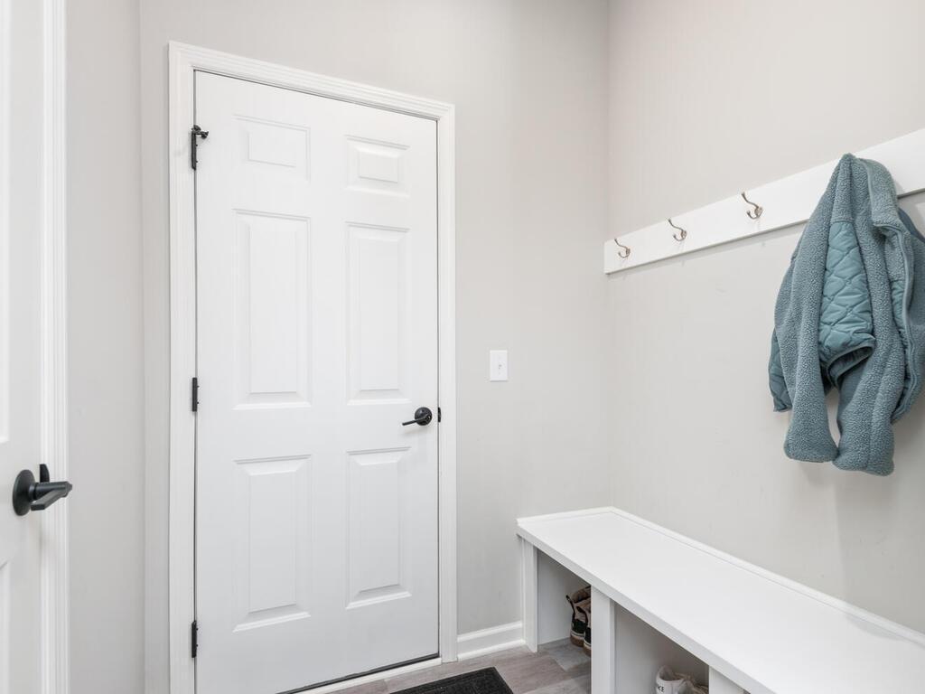 Coat closet along with bench and coat hangers!