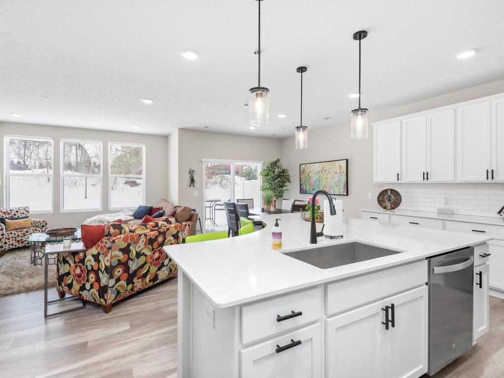 Huge center island! Custom backsplash, black accents and more!