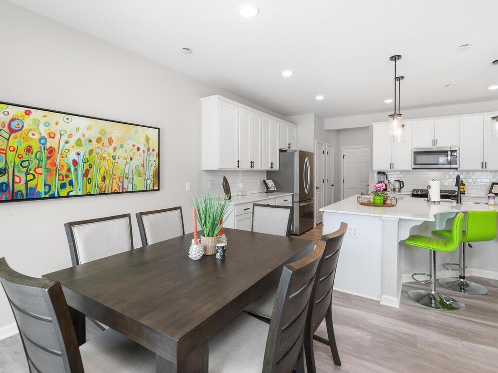 Features include luxury plank flooring, recessed lighting, beautiful cabinetry, solid surface counters and huge gathering space!