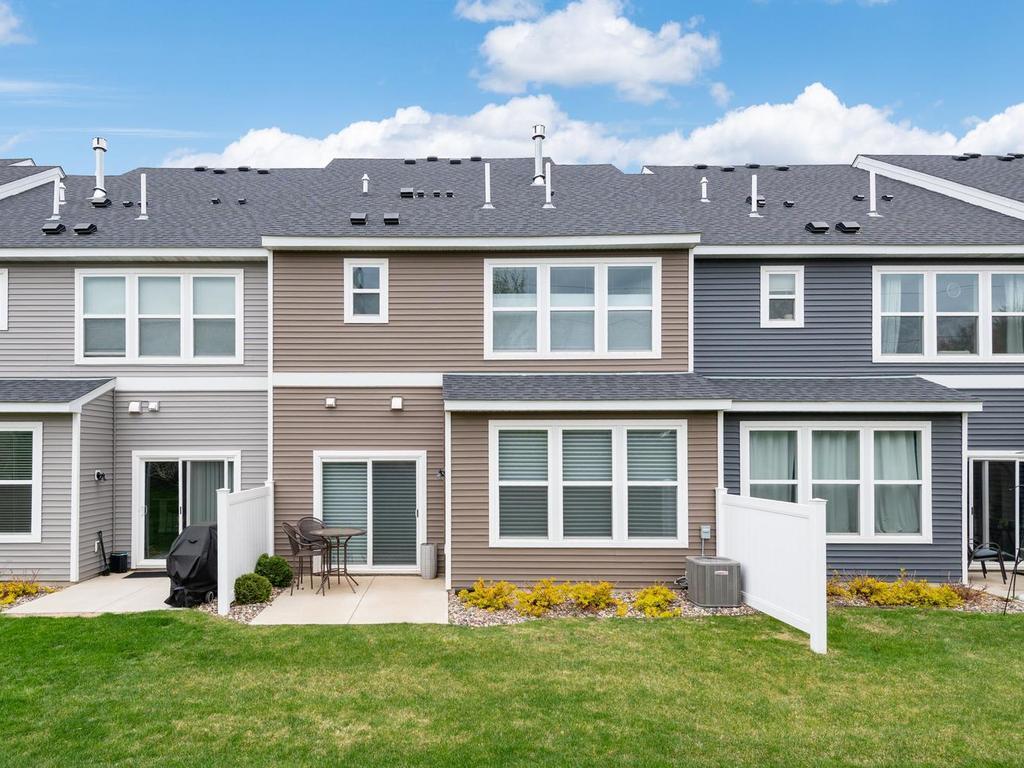 Nice East facing backyard with green space!