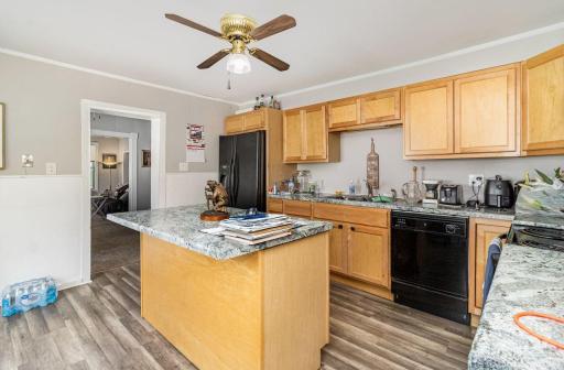 unit 2 kitchen. ceiling fan, center island