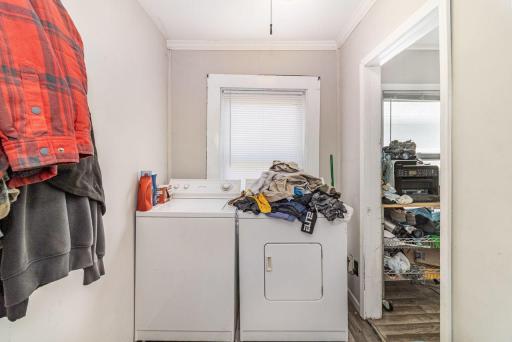 unit 2 laundry. this area has back door entrance and entrance to basement.