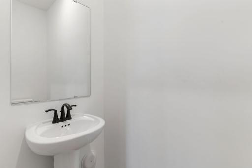In a discreet location on the first floor is a convenient powder room to accommodate the needs of the whole household and visiting guests.