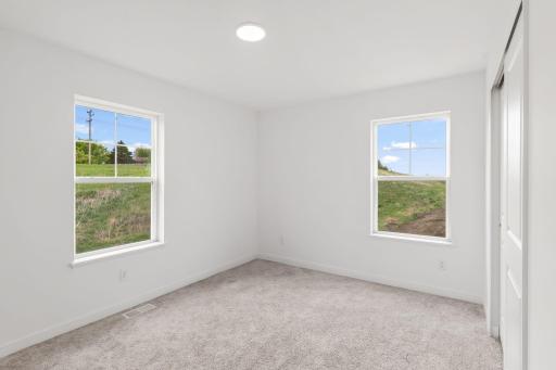The two secondary bedrooms can be found on the top level to provide a quiet haven away from the bustling downstairs main living area.