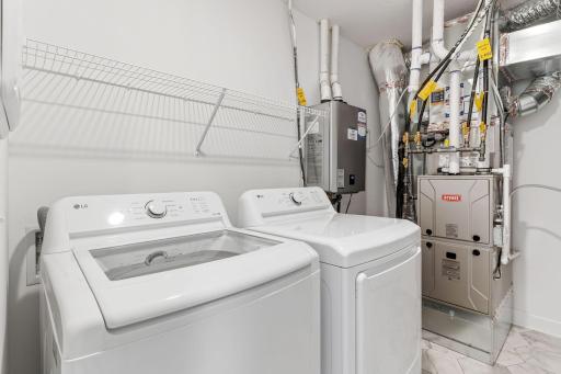 The laundry room features ventilated shelving for your storage needs