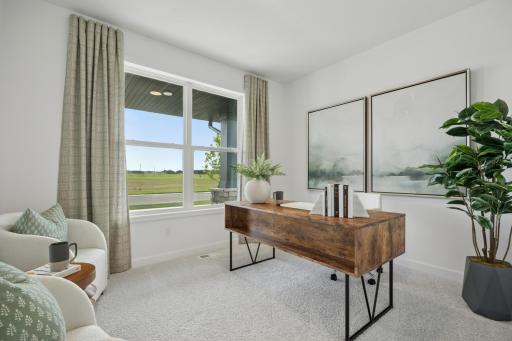 (Photo of a decorated model, actual homes finishes will vary) The main level flex room.
