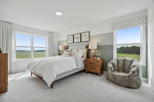 (Photo of a decorated model, actual homes finishes will vary) One of three secondary bedrooms.
