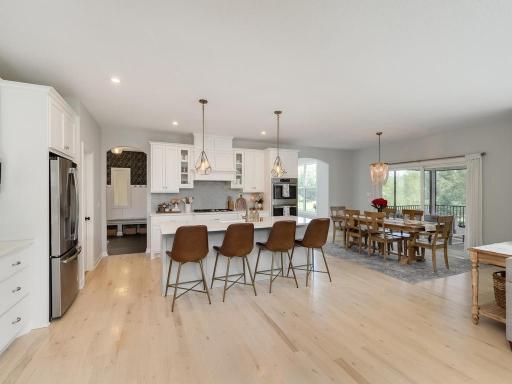 Kitchen features soft close D&D's Quartz Countertops and true white oak hardwood floors