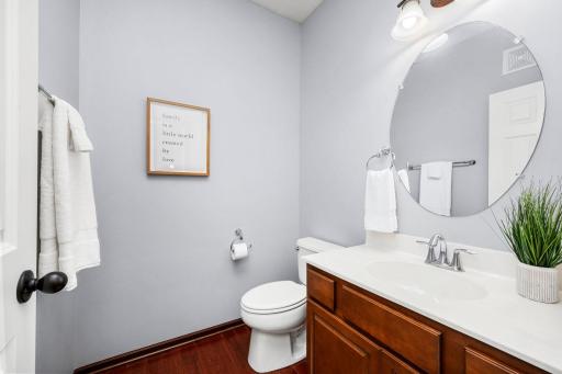A convenient main-level powder room adds comfort and functionality for family and friends.
