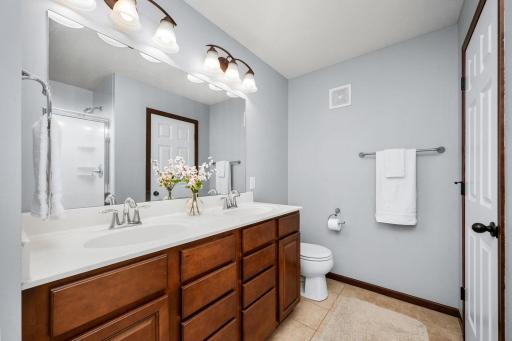 A spacious primary bath with double sinks and generous shower completes the owner's retreat.