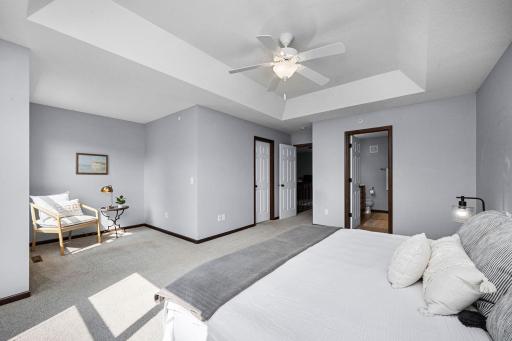 The spacious primary suite includes a charming nook for quiet moments.