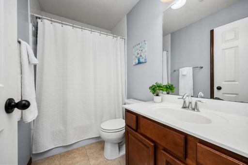 A bright and inviting bathroom serves the secondary bedrooms with ease.