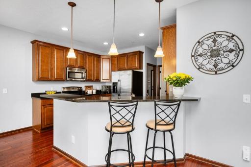 Breakfast bar seating creates the perfect spot for casual meals , coffee, and conversation.