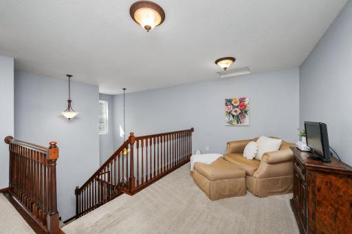 Versatile loft perfect for a home office, reading nook, or study space.