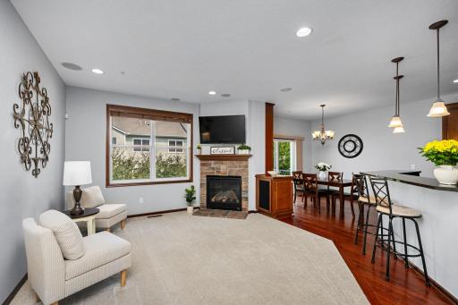 Enjoy the stunning stone gas fireplace and large windows that fill the space with natural light.