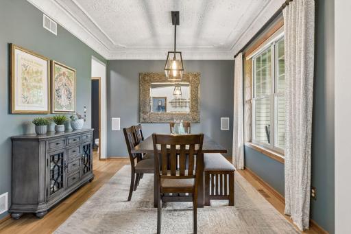 Main level formal dining room with decorative tin ceiling