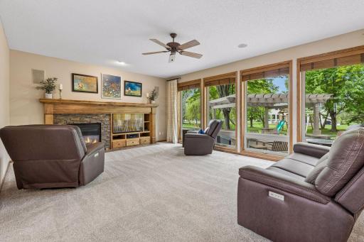 Spacious living room with expansive backyard views