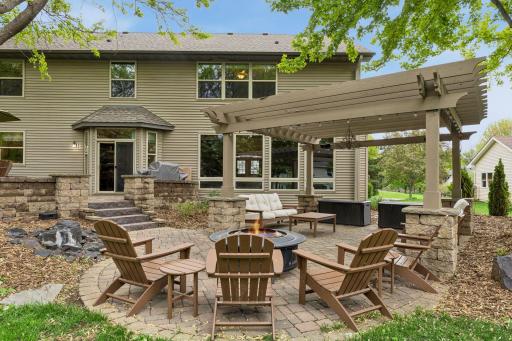 Outdoor living area with pergola and waterfall feature