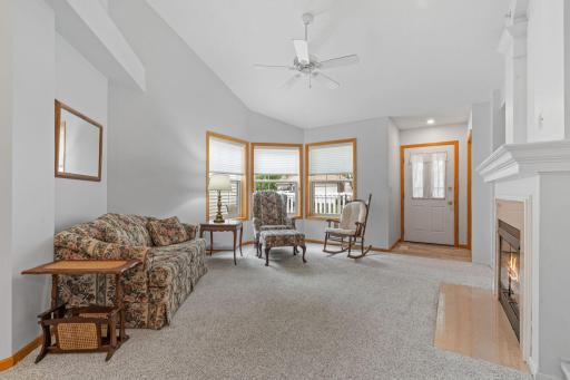 Wonderful living room with abundance of South facing windows & soaring vaulted ceilings are appealing