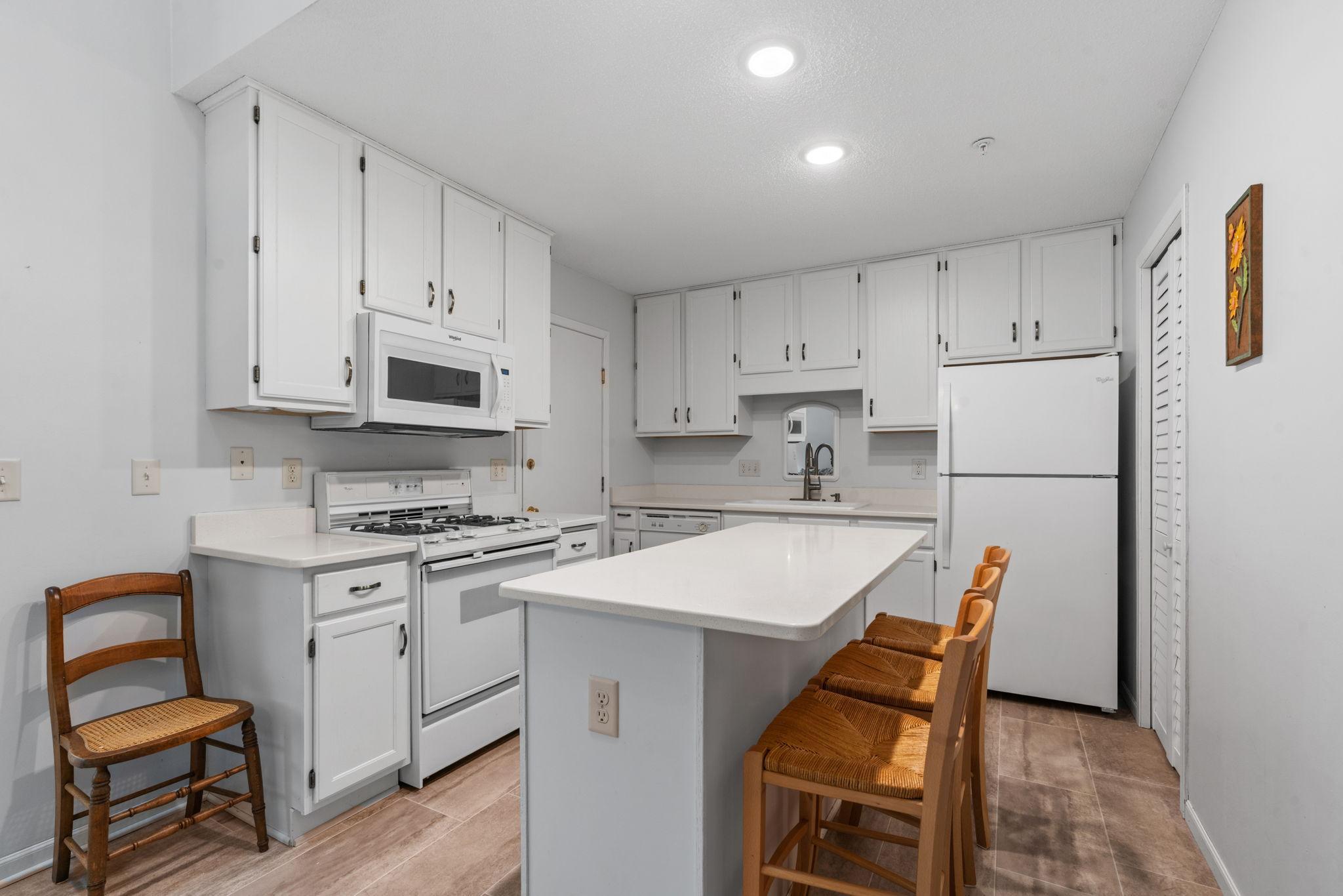 Freshly updated kitchen with quartz countertops & center island