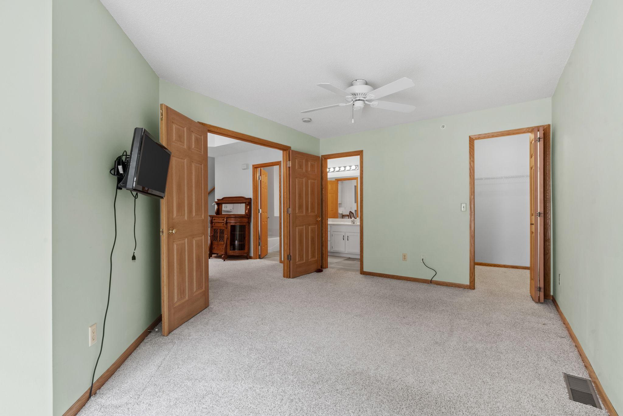 A bonus walk in closet plus luxurious walk through bath is delightful