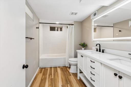 Lower-level bathroom is convenient to 3rd bedroom
