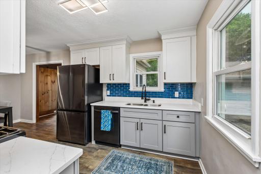 Beautiful kitchen with glass tile backsplash