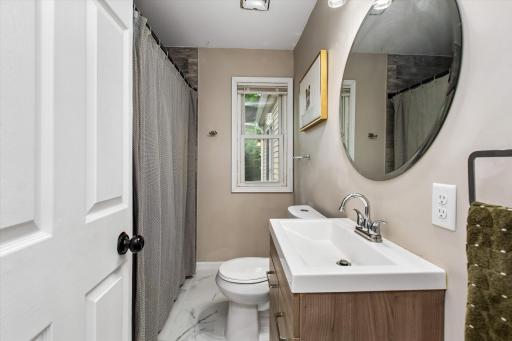 Main level full bath. Beautiful, updated floors