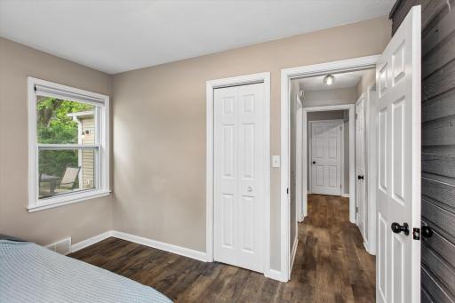 Second bedroom showing paneled doors throughout home