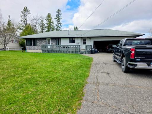 Front yard, deck & attached garage