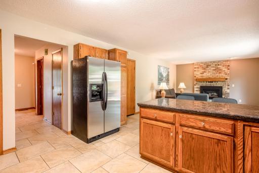 The open-concept kitchen overlooks the family room, creating an ideal space for entertaining and everyday living.